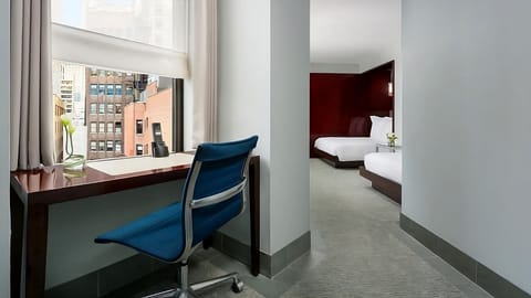 Catch up on emails at a bright desk by the window.