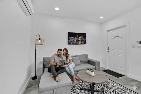 Relax in this modern studio featuring a comfortable queen bed, AC, and a cozy living area with a Smart TV. Perfect for a romantic getaway or business travel. Enjoy this bright, open-concept rental!