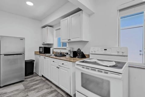 Modern kitchen with full-size appliances and natural light—perfect for guests who love to cook.