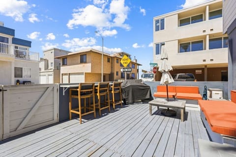 Sun-drenched private deck equipped with outdoor seating and a dining area—ideal for soaking up the San Diego sunshine.