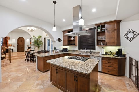 Sleek granite countertops with stylish Italian flooring throughout.