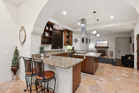 Two extra dining chairs at the kitchen counter.