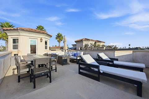A spacious rooftop terrace showcasing uninterrupted, panoramic views of the ocean.