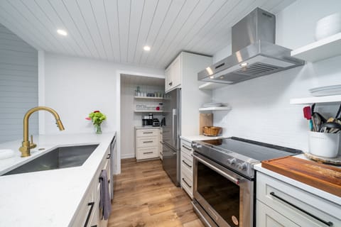 The kitchen opens into the great room. Beautiful stainless steel appliances.
