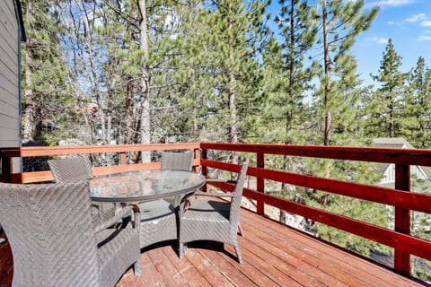 Private outdoor deck, surrounded by tall pines, perfect for relaxing under the trees after a day of adventure—enjoy peaceful forest views, fresh air, and a truly rejuvenating stay.