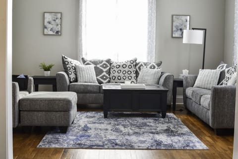 Living room with two couches and an oversized chair perfect for a comfy day in!