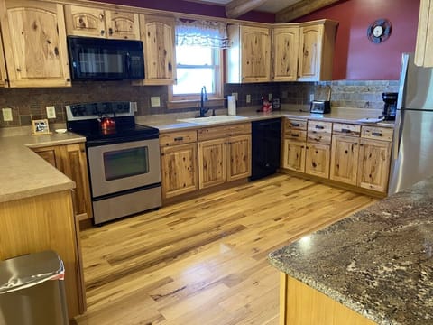 Huge gourmet kitchen with stainless steel appliances