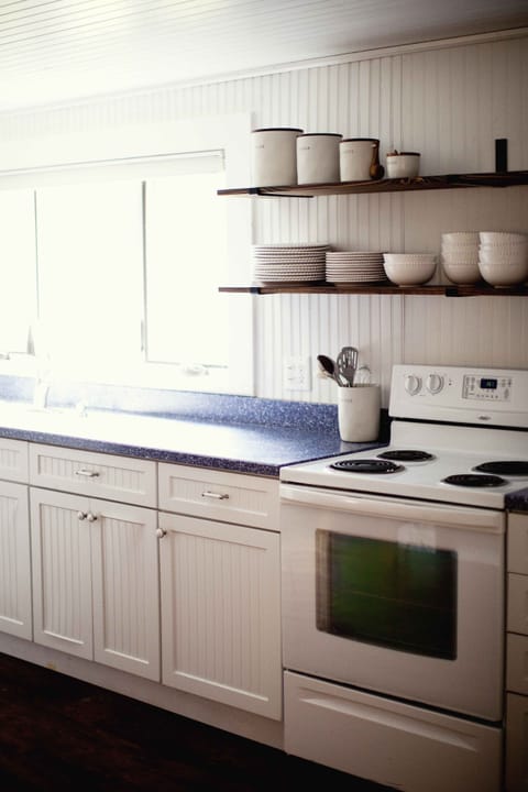 Cozy kitchen fully stocked with kitchen essentials.