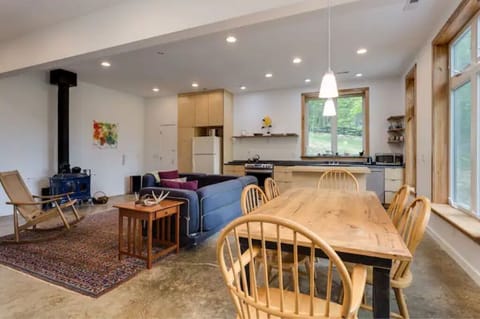 Open living/kitchen/dining on the ground floor. High ceilings, flooded w/ light.