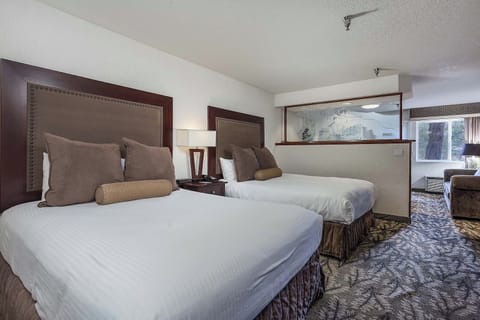 Unwind in plush beds with calming, spacious room layout