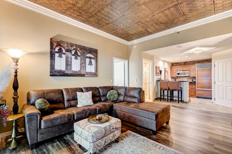 Luxurious living room with custom tin ceiling.