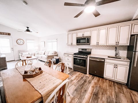 Living space, dining area and kitchen - laundry not pictured but in unit 