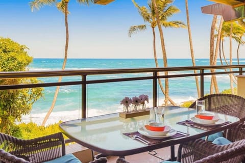 Private seaside balcony offering direct Pacific views and outdoor dining.