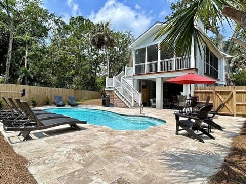 111 Forest Trail, Isle of Palms, South Carolina welcomes visitors with a beautiful exterior and private pool!
