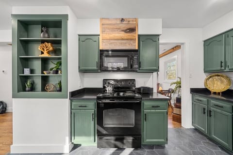 Kitchen is outfitted with an Electric Range