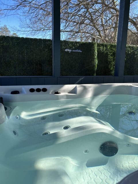 Stay a while! In a private hot tub inside of screened-in patio that is just for you!