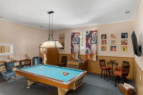 Our game room features a vintage pool and foosball table.