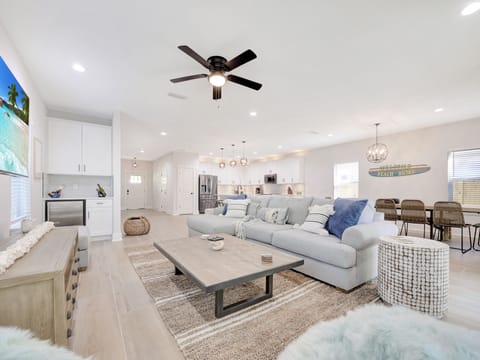 living area with large, deep sofa and two bean bag chairs