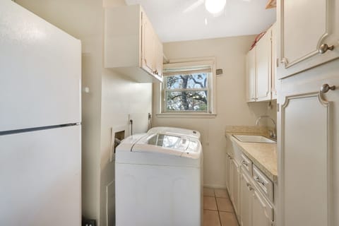 Laundry room with washer and dryer off of the kitchen
