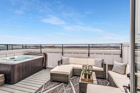 Rooftop oasis featuring a hot tub and panoramic Nashville views