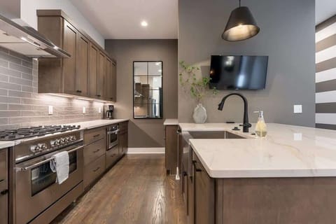 Enjoy a complete kitchen setup with island and essentials.