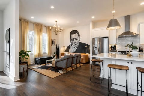 Living room featuring a bold mural of Johnny Cash for a unique artistic touch.