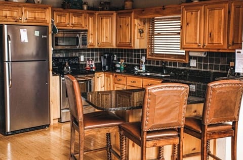 Beautiful chef's kitchen has everything you need!! Breakfast bar seats 3.