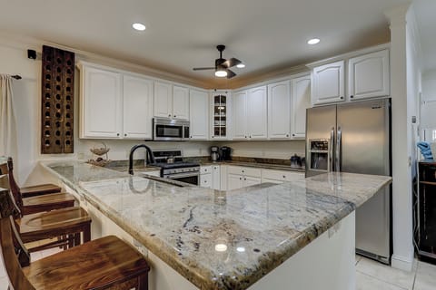 Fully stocked kitchen kitchen with stainless steel appliances