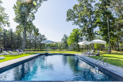 Pool overlooking horse farm 