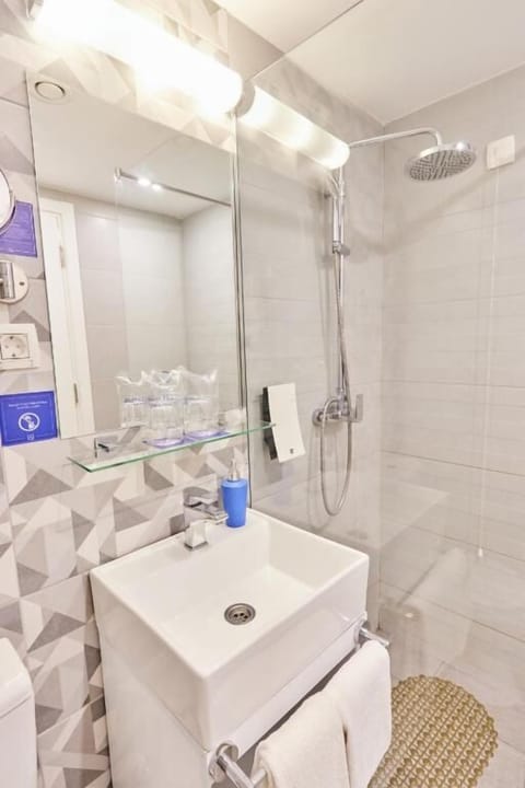 Full bathroom with a shower. Basic toiletries and towels are provided