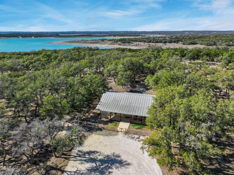 Aerial view of home showing beautiful Canyon Lake in the background.