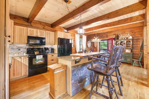 In this open floor plan kitchen, tradition and modernity come together to create a space that invites you to savor the beauty of the past while embracing the convenience of the present. 