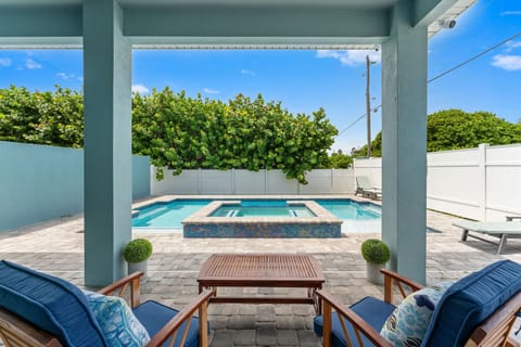 Relax in the shade next to Beach Haven's private pool and hot tub.