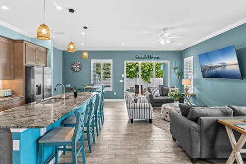 Beach Haven offers plenty of space on the ground floor with a stunning kitchen and a comfy living area featuring an 85" smart tv. 