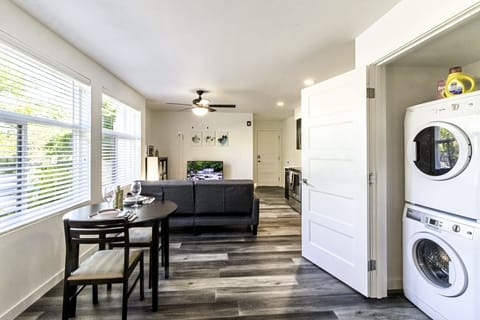 Apt 101 studio unit with the sofa bed, TV, dining table for 2, washer and dryer