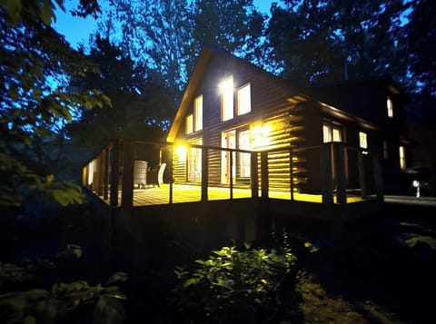 Dusk at “Coloma Loghoma” on the Paw Paw river. Exceptional Log Cabin Stay!