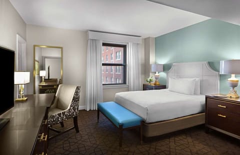 Settle in with a roomy king retreat and handy work desk.