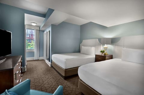 Drift off in crisp linens in a calm double-queen room.