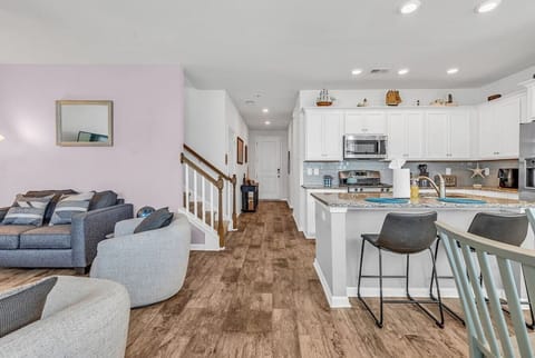 Enjoy an open floor plan on the first floor with kitchen, living, and dining spaces