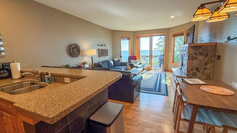 Windsong 610 has an open layout living area with a kitchen, dining area, and living room.