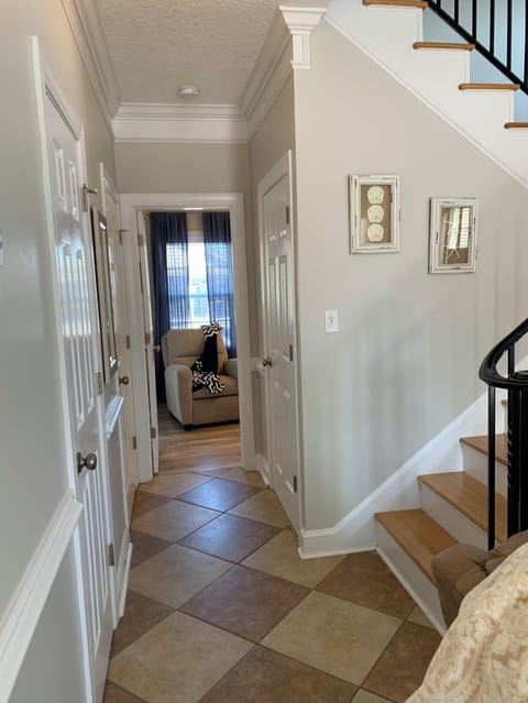 Stairs leading to second floor.  Hallway leading to downstairs king bedroom.  