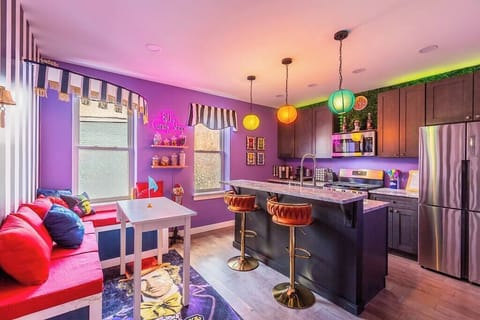 Step aboard the Wonkatania! Our vibrant kitchen space, fully equipped with colorful cookware for creating delicious breakfasts. Enjoy the convenience of a kitchen island, perfect for two, making every meal a delightful experience.