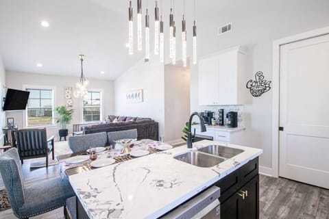 "Seamless Dining and Living: Dining Room Conveniently Located Next to Living Room - Perfect for Entertaining and Gathering with Family and Friends"