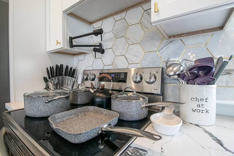 "Cook with Ease and Style: Electric Flat Top Stove with 5 Burners, Oven, and Pot Filler - Perfect for Preparing Delicious Meals for You and Your Loved Ones"