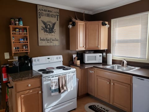 kitchen with stove, refrigerator, dishwasher, and microwave