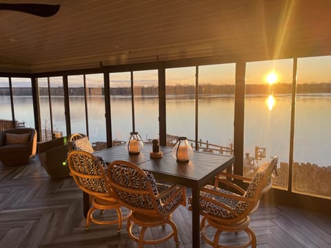 Enjoy the sunrise over the river from the enclosed sunroom


