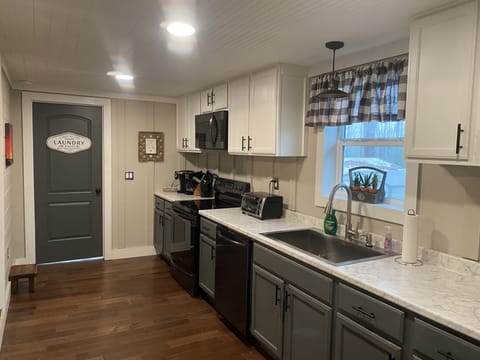 Kitchen leads into the laundry room w/ washer & dryer.
