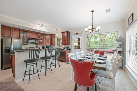 Dinning table with seating for eight and lots of natural light.