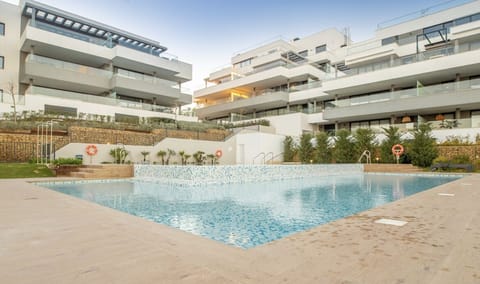 Outdoor pool has showers and bathroom.