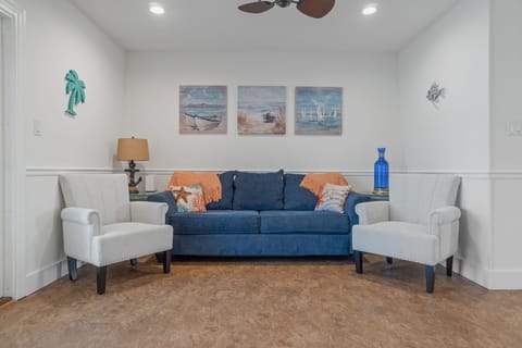 Relax in the cozy living room with a queen sofa bed
